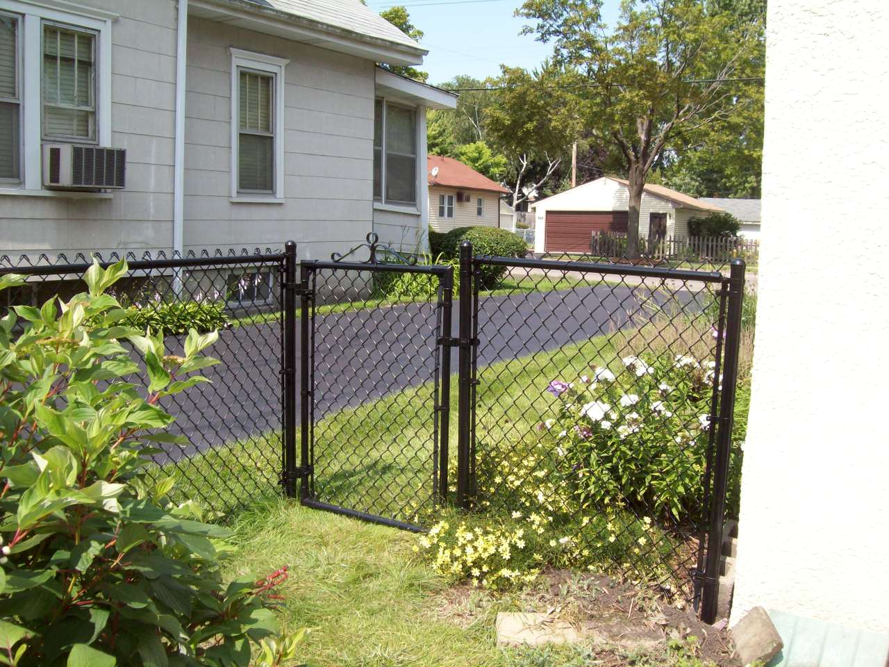 black coated chain link fence and gate | Backyard fences, Easy fence ...